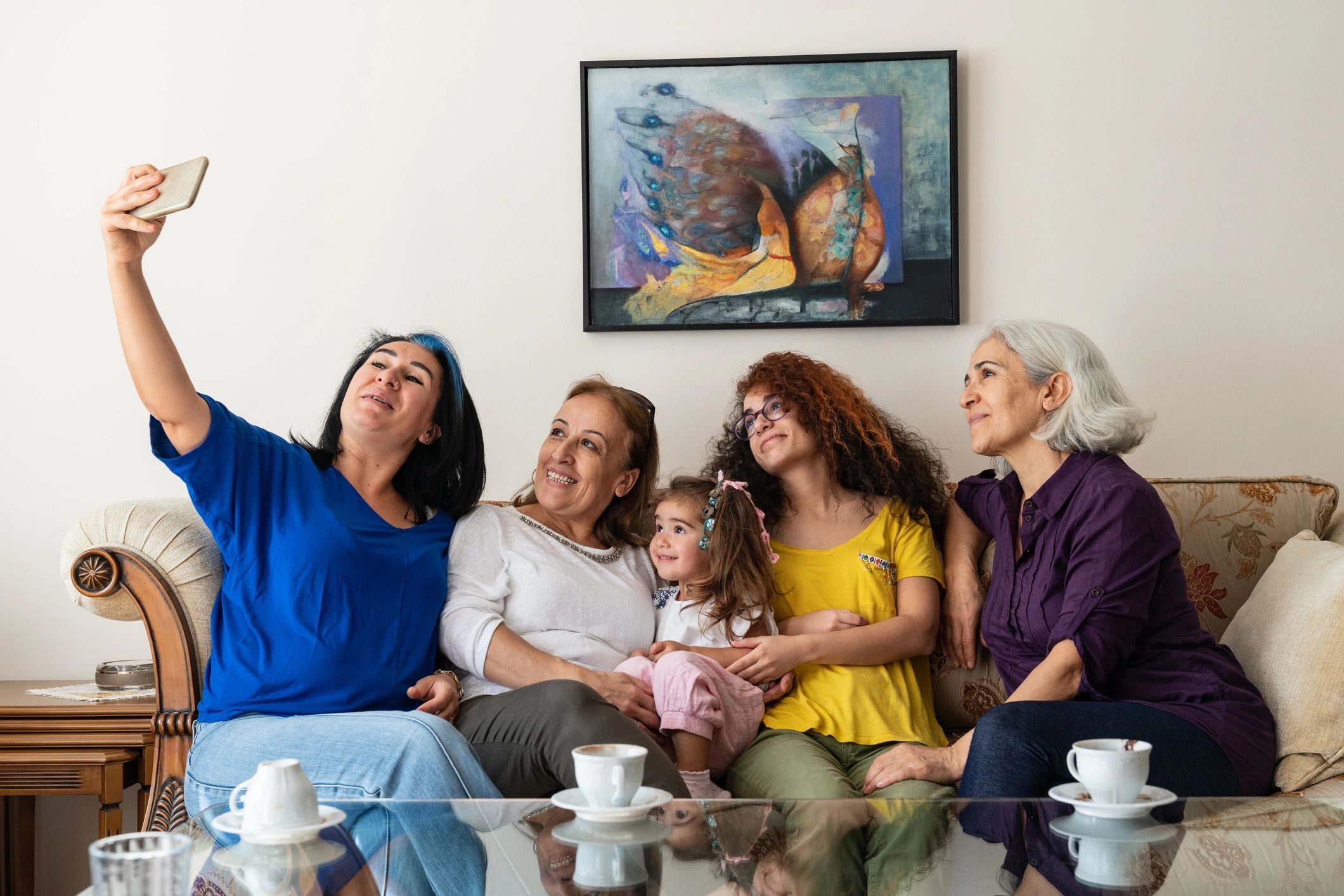 Multi-generational family together in living room
